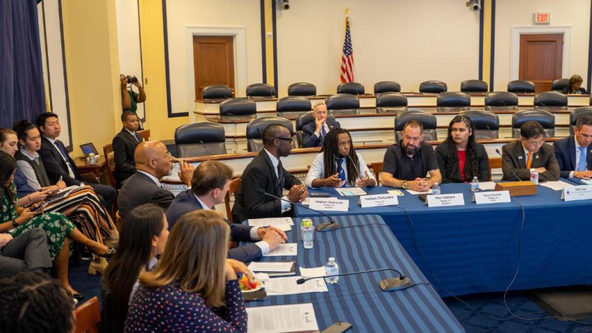 Rep. Scholten sits at Equality Caucus Meeting